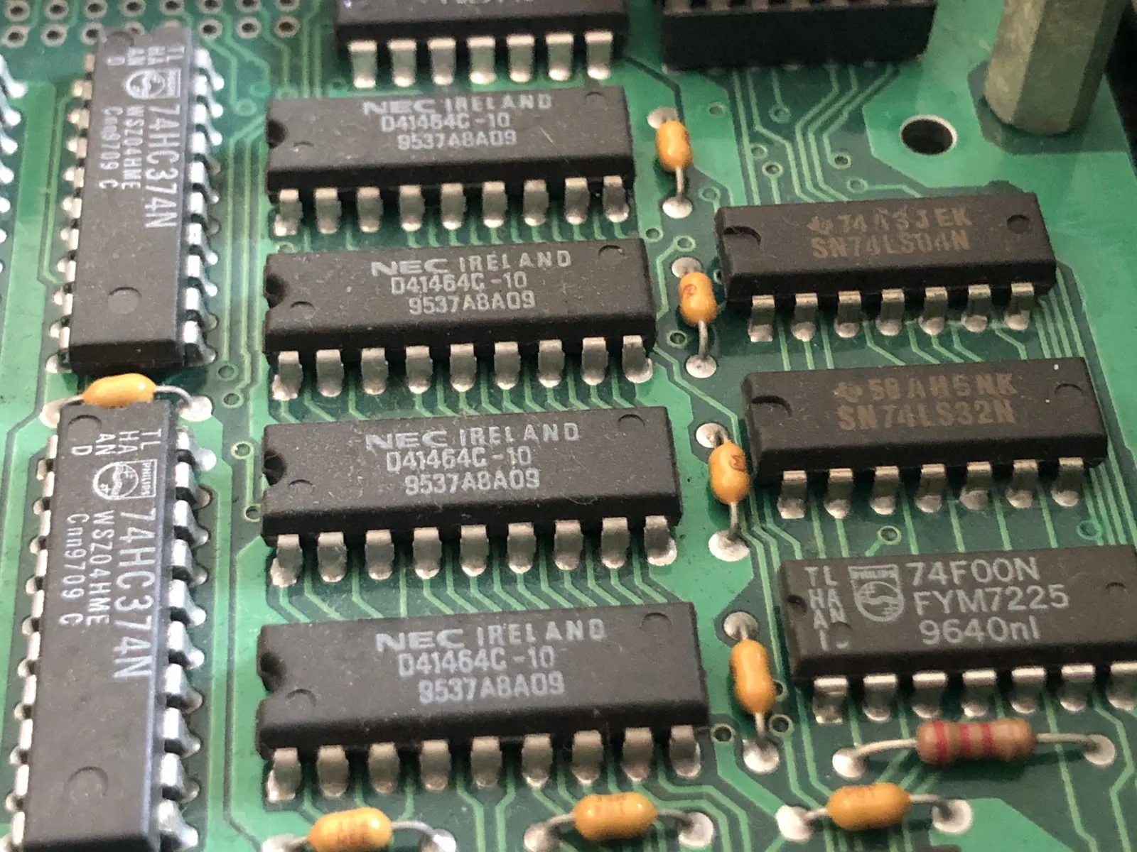 Four identical chips marked NEC IRELAND and D41464C-10 in a row.
