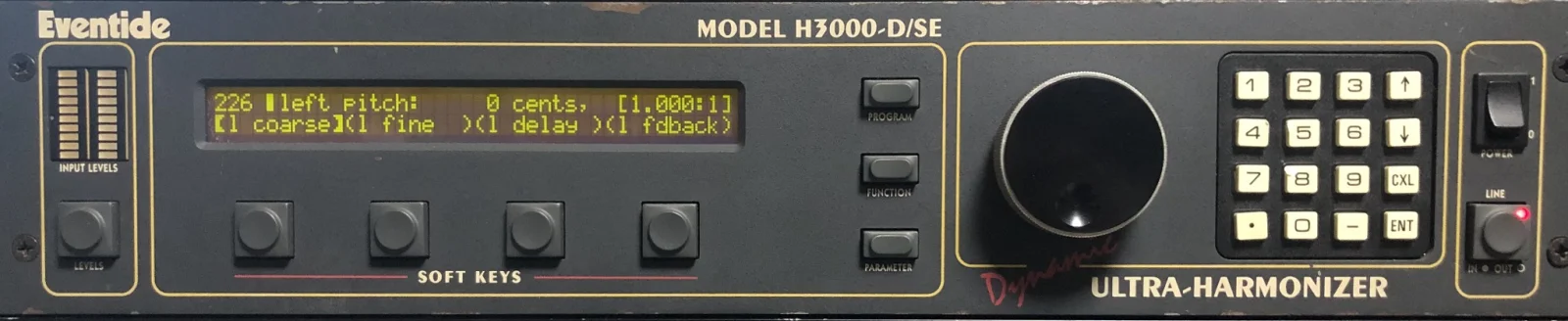 The complete H3000-D/SE front panel. From left: Eventide logo, INPUT LEVELS meters and LEVELS button; yellow-green LCD showing “226 left pitch: 0 cents, [1.000:1]” and l coarse, l fine, l delay and l fdback, with four soft keys below; PROGRAM, FUNCTION and PARAMETER buttons; knob and 4 × 4 keypad; POWER switch and LINE button. MODEL H3000-D/SE appears above, with red Dynamic script and ULTRA-HARMONIZER below.